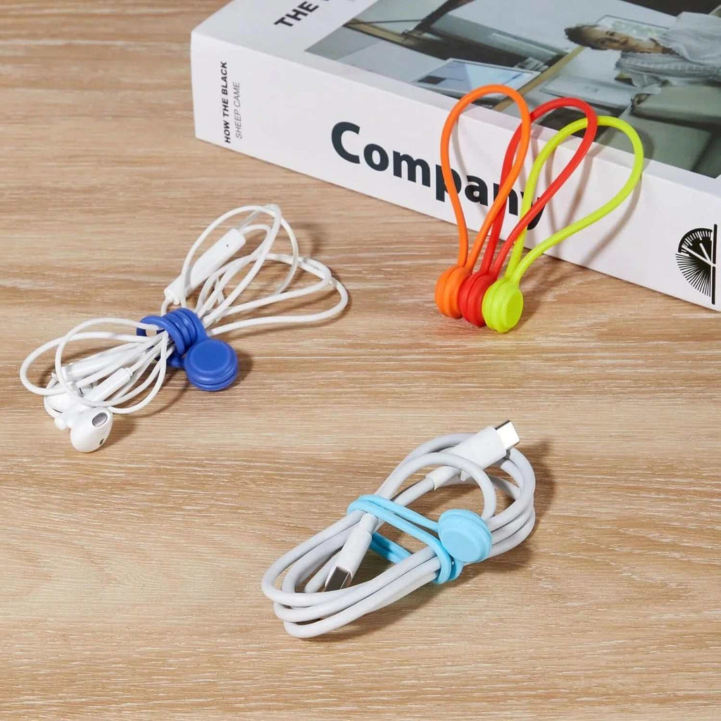 Set of 10 reusable magnetic silicone cable ties organizing earbuds and USB cords for home and office use