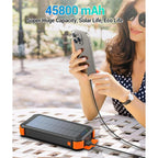 45800mAh solar power bank with built-in cables, multiple ports, fast charging, and LED flashlight for iPhone and Android phones