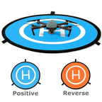 Orange and blue foldable drone landing pad with reflective strips for DJI Mavic and other drones